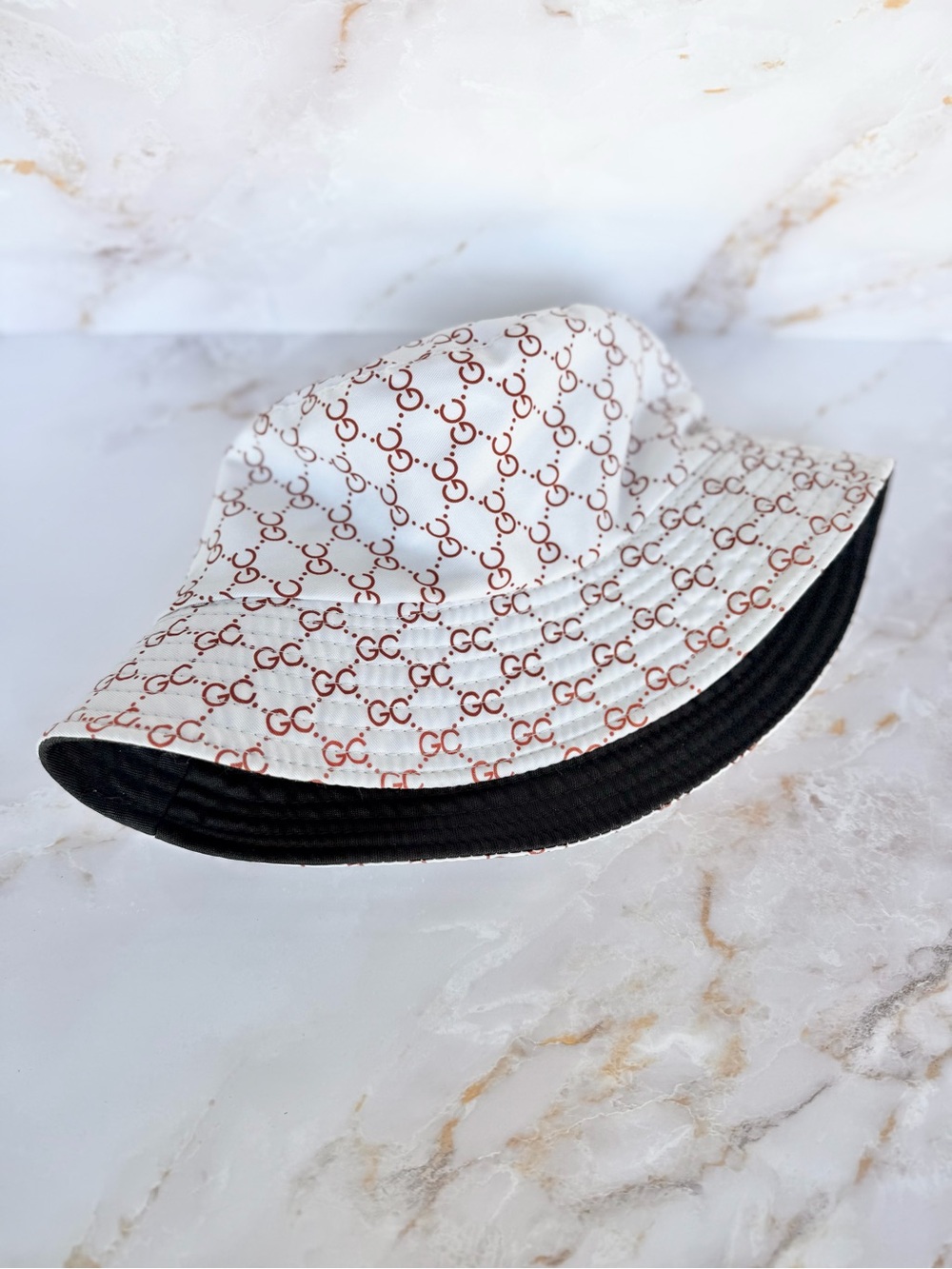 GC Print Reversible Bucket Hat in White and Black